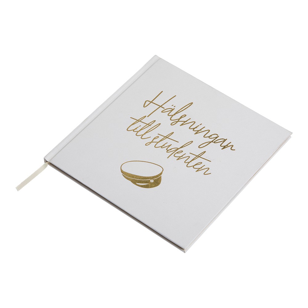 Vit fin gästbok med guldtryck till studenten.